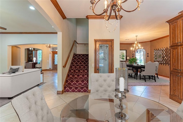 2612 SW 137th St, Oklahoma City, OK 73170 - foyer entrance featuring a chandelier, stairway, crown molding, baseboards, and light tile patterned floors