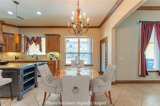 2612 SW 137th St, Oklahoma City, OK 73170 - dining area with a chandelier, light tile patterned floors, healthy amount of natural light, ornamental molding, and recessed lighting