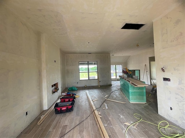unfurnished living room with wood finished floors