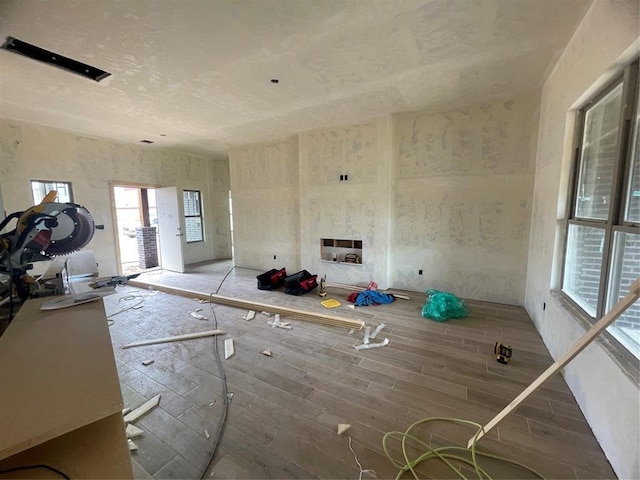 unfurnished living room with wood finished floors
