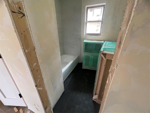 bathroom with a bath and vanity