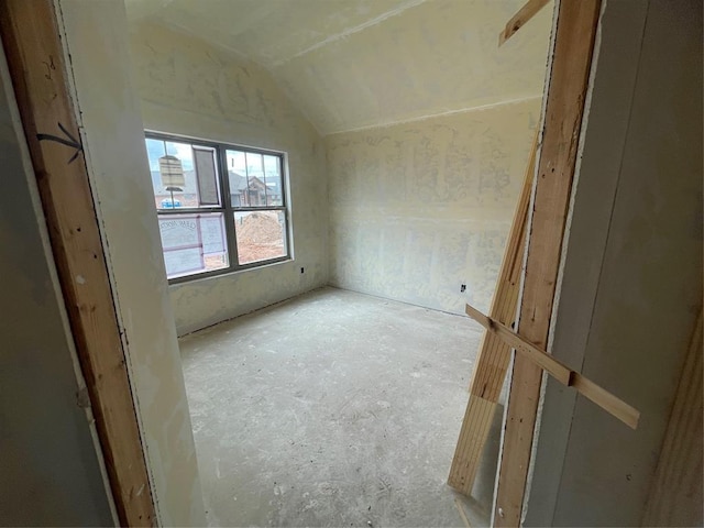 empty room with vaulted ceiling