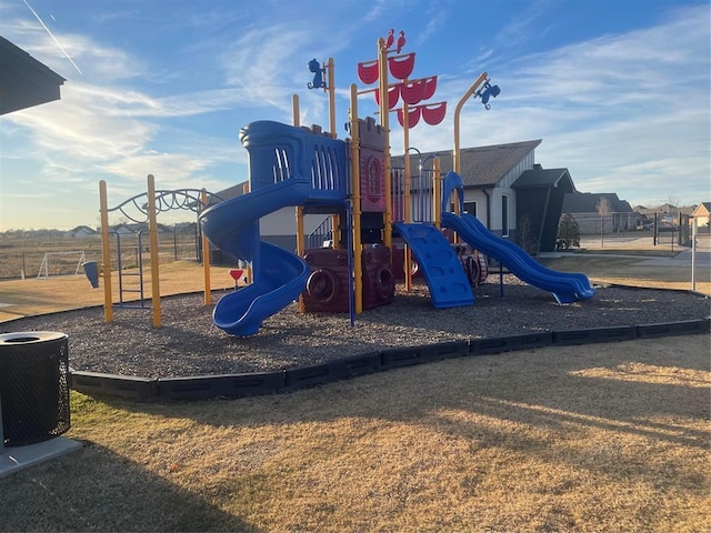 community jungle gym with fence and central AC unit