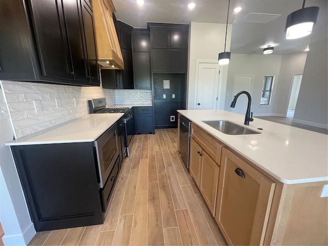 5012 Misty Wood Ln, Mustang, OK 73064 - kitchen with gas range, light wood-style flooring, premium range hood, light countertops, and backsplash