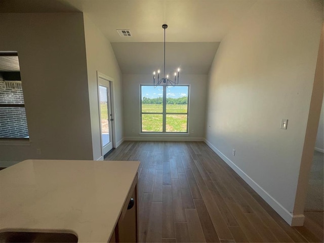5012 Misty Wood Ln, Mustang, OK 73064 - unfurnished dining area featuring a chandelier, dark wood-style floors, and lofted ceiling