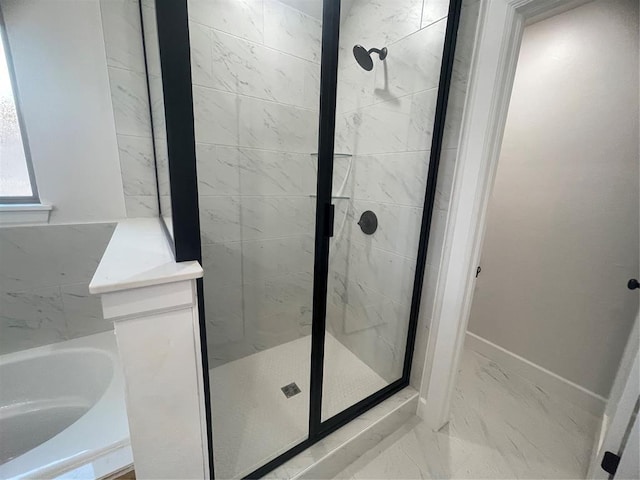5012 Misty Wood Ln, Mustang, OK 73064 - bathroom with a garden tub, a shower stall, and marble look tile flooring