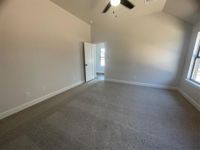 5012 Misty Wood Ln, Mustang, OK 73064 - carpeted spare room with vaulted ceiling, a ceiling fan, and plenty of natural light