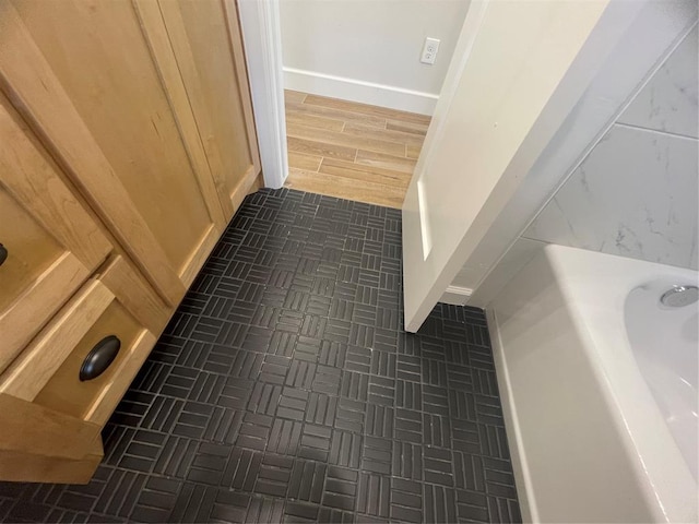 5012 Misty Wood Ln, Mustang, OK 73064 - bathroom featuring baseboards
