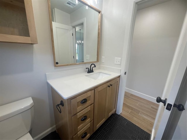 5012 Misty Wood Ln, Mustang, OK 73064 - half bathroom featuring vanity and wood finished floors