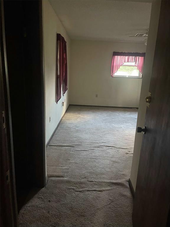 329131 E Lincoln St, Harrah, OK 73045 - unfurnished room featuring carpet flooring