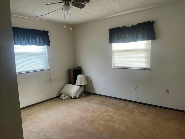 329131 E Lincoln St, Harrah, OK 73045 - unfurnished room with carpet, a textured ceiling, ceiling fan, and baseboards