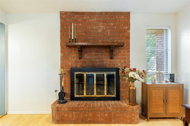 4113 Monica Dr, Del City, OK 73115 - detailed view of wood finished floors and a fireplace