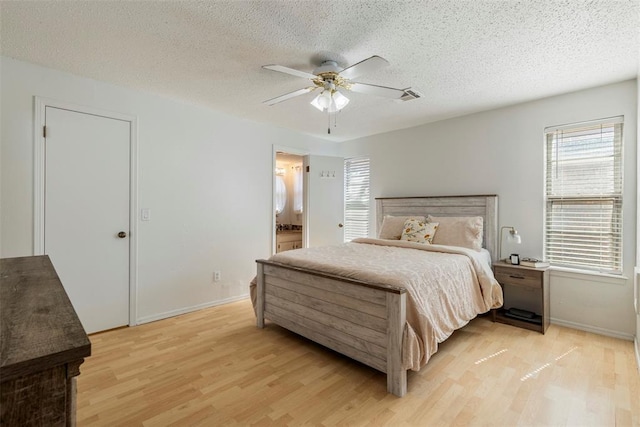 4113 Monica Dr, Del City, OK 73115 - bedroom featuring light wood-type flooring, multiple windows, a textured ceiling, baseboards, and ceiling fan