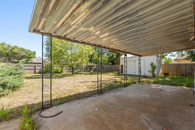 4113 Monica Dr, Del City, OK 73115 - view of patio / terrace with a storage unit and an outdoor structure