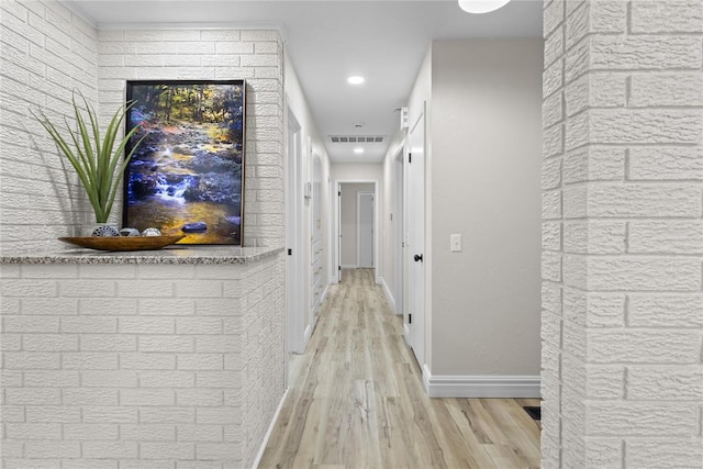 corridor featuring visible vents, wood finished floors, baseboards, and recessed lighting