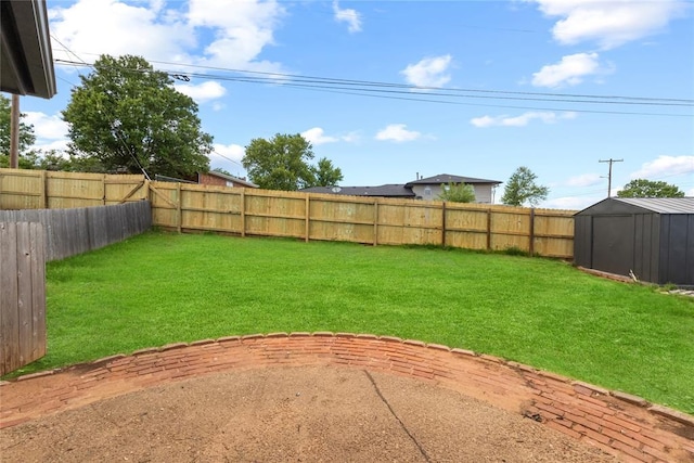 view of yard with a storage shed, an outbuilding, a fenced backyard, and a patio