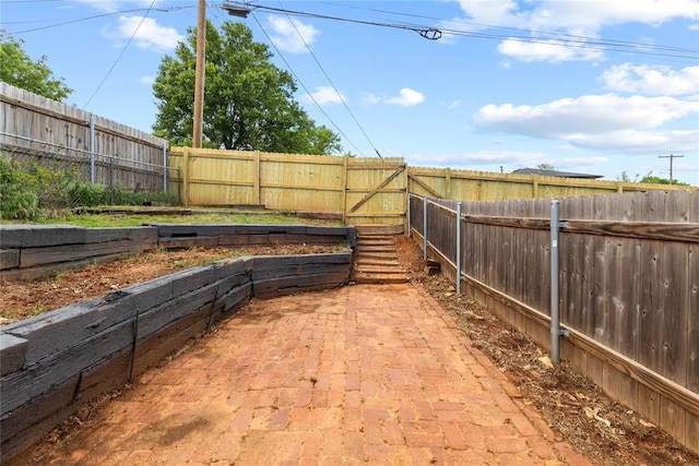 view of yard featuring a fenced backyard and a patio
