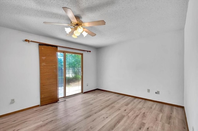 unfurnished room featuring a textured ceiling, wood finished floors, and a ceiling fan