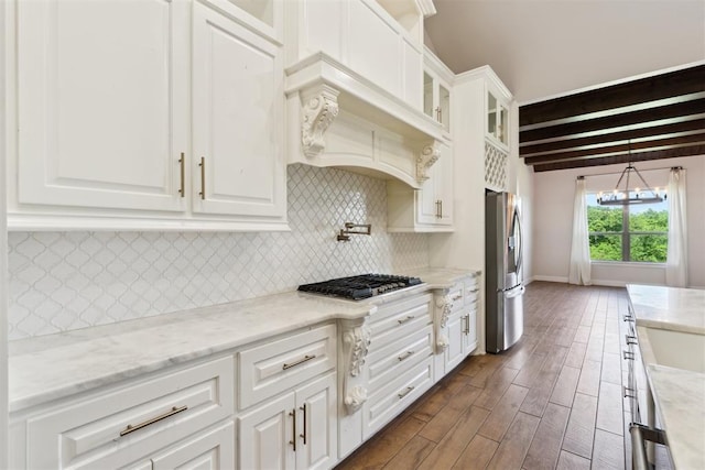1111 Colonial Ave, Tuttle, OK 73089 - kitchen featuring tasteful backsplash, white cabinets, appliances with stainless steel finishes, and dark wood-type flooring