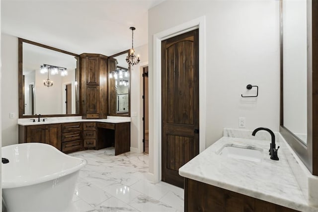 1111 Colonial Ave, Tuttle, OK 73089 - bathroom with an inviting chandelier, a freestanding bath, marble finish floor, and vanity