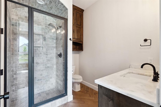 1111 Colonial Ave, Tuttle, OK 73089 - full bathroom with vanity, toilet, baseboards, and a shower stall