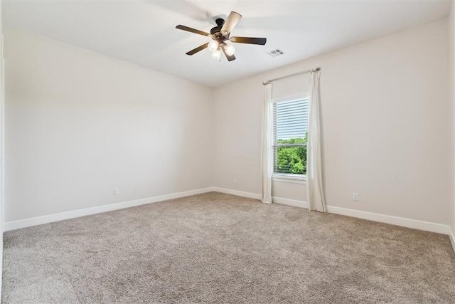 1111 Colonial Ave, Tuttle, OK 73089 - empty room featuring ceiling fan, carpet, baseboards, and visible vents