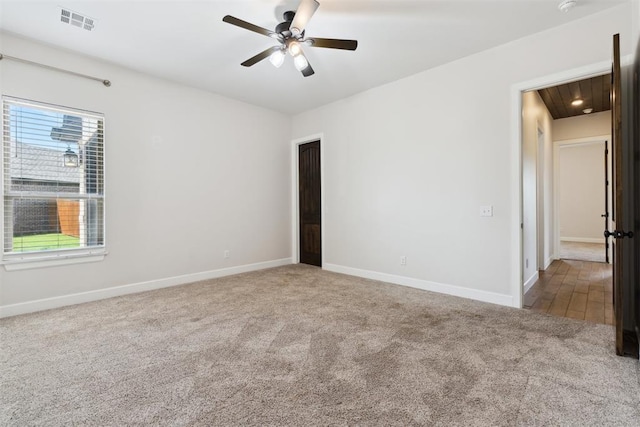 1111 Colonial Ave, Tuttle, OK 73089 - unfurnished room with baseboards, ceiling fan, visible vents, and carpet floors