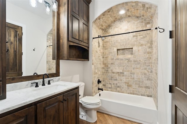 1111 Colonial Ave, Tuttle, OK 73089 - full bath featuring toilet, shower / bathtub combination, vanity, and wood finished floors