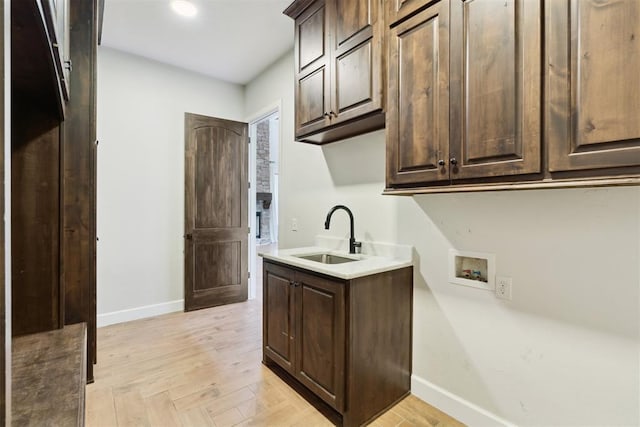 1111 Colonial Ave, Tuttle, OK 73089 - clothes washing area with a sink, cabinet space, recessed lighting, washer hookup, and baseboards