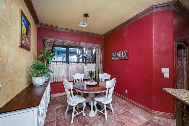 dining room with baseboards, ornamental molding, a chandelier, and a textured wall