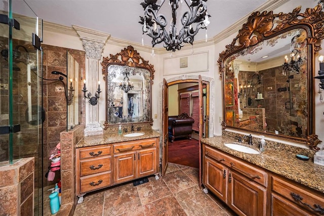 full bathroom with an inviting chandelier, a stall shower, ornamental molding, and a sink