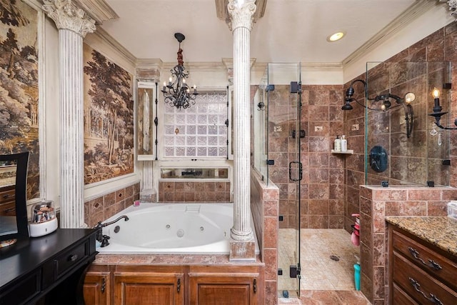 bathroom featuring a stall shower, an inviting chandelier, crown molding, a tub with jets, and ornate columns
