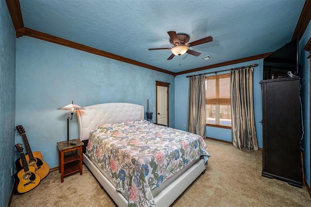 carpeted bedroom featuring a ceiling fan, a textured ceiling, baseboards, visible vents, and crown molding