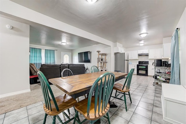 700 Redwood Dr, Noble, OK 73068 - dining space with light tile patterned floors and light carpet