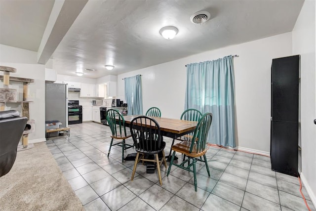 700 Redwood Dr, Noble, OK 73068 - dining room featuring light tile patterned floors and baseboards