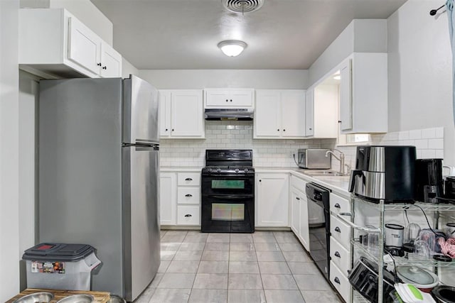 700 Redwood Dr, Noble, OK 73068 - kitchen featuring black appliances, under cabinet range hood, light countertops, backsplash, and white cabinetry