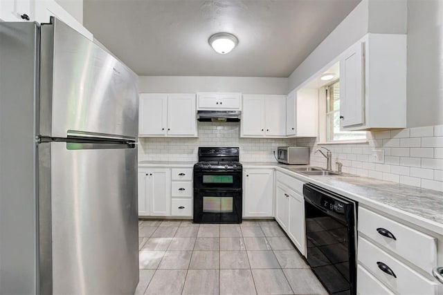 700 Redwood Dr, Noble, OK 73068 - kitchen featuring black appliances, under cabinet range hood, light countertops, and tasteful backsplash