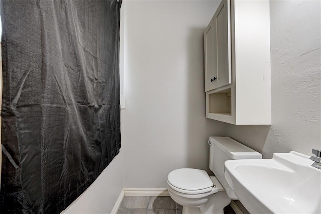 700 Redwood Dr, Noble, OK 73068 - bathroom with toilet and a sink