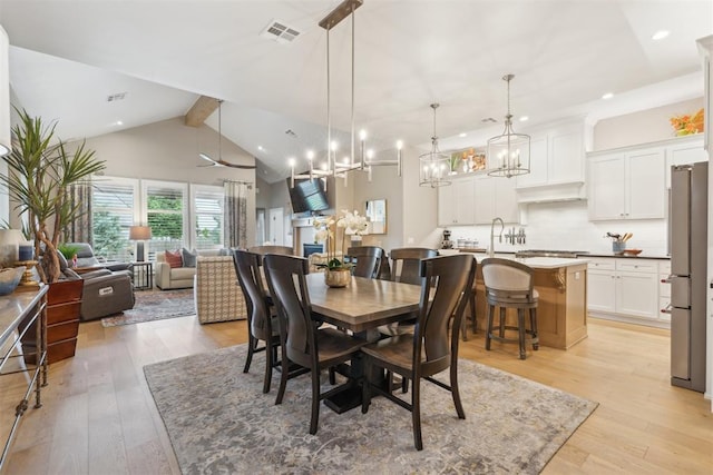 dining room featuring recessed lighting, a chandelier, and light wood-style flooring