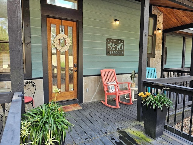 entrance to property featuring a porch