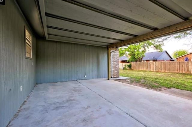 view of patio featuring fence