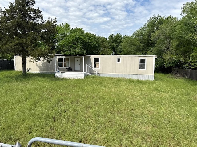 view of front of property with a porch and a front lawn