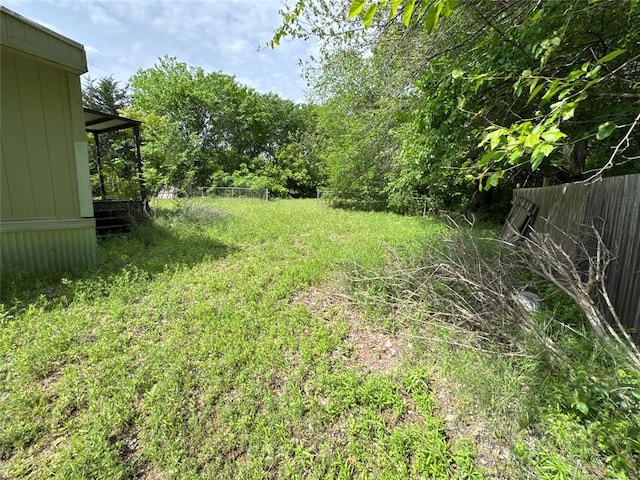 view of yard with fence