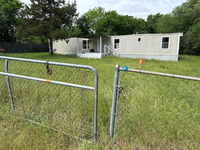view of front of property with fence private yard and a front yard