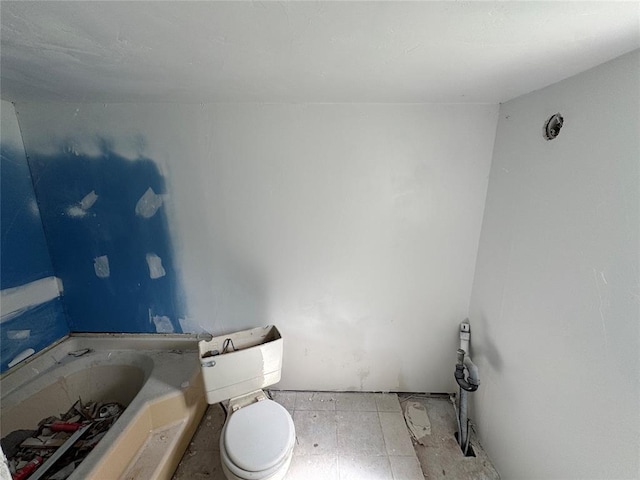 bathroom featuring toilet and a bath