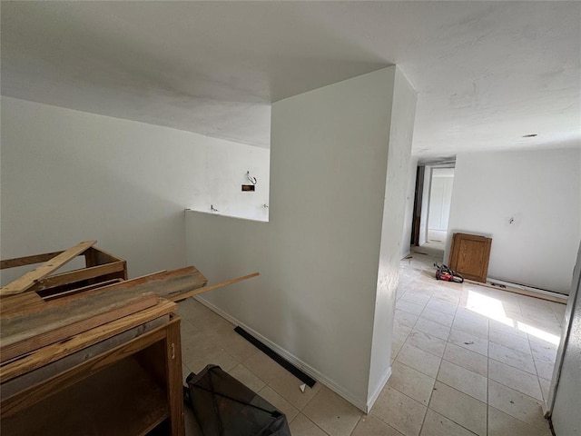 stairway featuring tile patterned floors