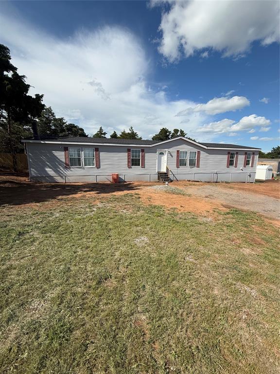 30738 NW Reno Rd, Hinton, OK 73047 - manufactured / mobile home featuring a front yard and entry steps
