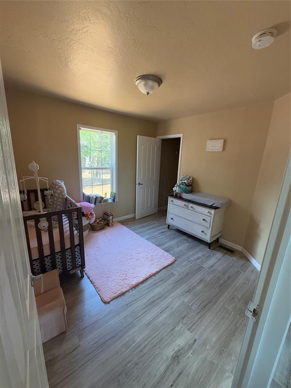 30738 NW Reno Rd, Hinton, OK 73047 - bedroom with light wood finished floors and baseboards