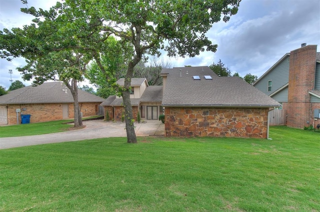 904 Carfax Rd, Edmond, OK 73034 - view of front of home with stone siding and roof with shingles