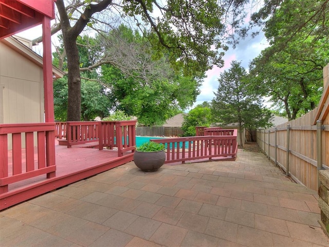 904 Carfax Rd, Edmond, OK 73034 - fenced backyard with a patio area and a wooden deck